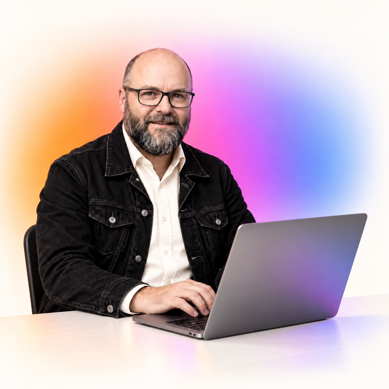 Simon Wilson working at a laptop